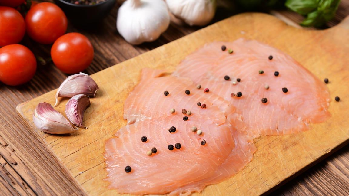 lean raw fish on cutting board